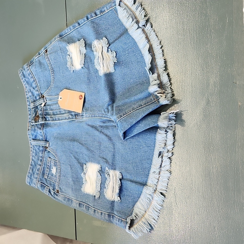 Distressed blue Jean shorts.